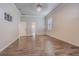 Spacious bedroom with wood-look tile floors, ceiling fan, and bright natural light at 3815 Gaviota Dr, Sun City Center, FL 33573