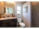 Bathroom featuring framed mirror, stone countertop and tiled shower at 3815 Gaviota Dr, Sun City Center, FL 33573