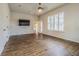 Large bedroom with wood look tile floors and large windows at 3815 Gaviota Dr, Sun City Center, FL 33573