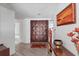 Inviting foyer featuring double doors, wood-look flooring, and elegant decor at 4000 40Th S St, St Petersburg, FL 33711