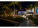 Landscaped backyard featuring an in-ground pool and an outdoor fire pit, all on the water at 751 34Th Ne Ave, St Petersburg, FL 33704