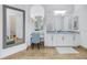 Bright bathroom featuring double vanity, makeup table and large mirror reflecting the open-concept space at 751 34Th Ne Ave, St Petersburg, FL 33704