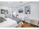 Modern bedroom design featuring luxurious bedding, stylish decor, and a TV for ultimate comfort at 751 34Th Ne Ave, St Petersburg, FL 33704