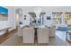 Elegant dining area with hardwood floors, stylish lighting, and picturesque views of the outdoors at 751 34Th Ne Ave, St Petersburg, FL 33704