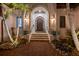 Welcoming front entrance with a decorative wood door, brick walkway and manicured landscaping at 751 34Th Ne Ave, St Petersburg, FL 33704