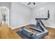 Spacious exercise room with hardwood floors, gray walls, treadmill and a rowing machine at 751 34Th Ne Ave, St Petersburg, FL 33704