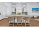 Modern kitchen with a large island, granite countertops, pendant lighting, and stainless steel appliances at 751 34Th Ne Ave, St Petersburg, FL 33704