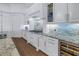 Kitchen with stainless steel appliances, granite countertops, custom cabinetry, and hardwood flooring at 751 34Th Ne Ave, St Petersburg, FL 33704