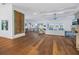 Open-concept living area with wood floors, stylish furnishings, fireplace, and water view at 751 34Th Ne Ave, St Petersburg, FL 33704