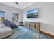 Comfortable living room with water views, an electric massage chair, and a mounted television at 751 34Th Ne Ave, St Petersburg, FL 33704