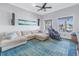 Relaxing living room featuring a comfortable sectional sofa, water views and an electric massage chair at 751 34Th Ne Ave, St Petersburg, FL 33704