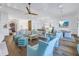 Spacious living room featuring hardwood floors, an open floor plan, and stylish coastal-inspired furnishings at 751 34Th Ne Ave, St Petersburg, FL 33704