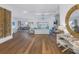Expansive living room boasts wood floors, coffered ceiling, fireplace, and water views at 751 34Th Ne Ave, St Petersburg, FL 33704