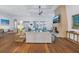 Bright living room featuring a stone fireplace, wood floors, and water views at 751 34Th Ne Ave, St Petersburg, FL 33704