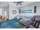 Spacious living room featuring a large sectional sofa, an electric massage chair and wall art at 751 34Th Ne Ave, St Petersburg, FL 33704