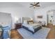 Main bedroom with a king bed, seating area and hardwood floors at 751 34Th Ne Ave, St Petersburg, FL 33704