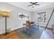 Bright home office features a modern desk setup, complemented by a stylish lamp and tuna artwork at 751 34Th Ne Ave, St Petersburg, FL 33704