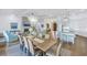 Bright open-concept living space featuring a dining area, kitchen island, and cozy living room at 751 34Th Ne Ave, St Petersburg, FL 33704