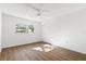 Bright bedroom with ceiling fan and natural light offering a comfortable and serene living space at 831 Maple Ct # 303, Dunedin, FL 34698