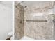 Updated shower featuring easy to clean solid-surface walls and updated shower head at 831 Maple Ct # 303, Dunedin, FL 34698