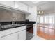 Modern kitchen with stainless steel appliances and ample counter space at 1033 Bowsprit Ln # 1406, Holiday, FL 34691