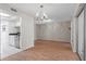 Open-concept living and dining area with views into the kitchen and lanai at 1033 Bowsprit Ln # 1406, Holiday, FL 34691