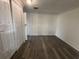 This cozy bedroom is well lit and has wood-look floors at 1833 Knollwood Dr, Holiday, FL 34690