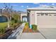Charming home exterior with a well-manicured lawn and an attached garage at 2932 Tanglewylde Dr, Land O Lakes, FL 34638