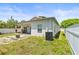 Nice backyard featuring a fire pit, a small patio, a fenced yard and an A/C unit at 3611 19Th N St, St Petersburg, FL 33713