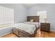A bedroom features wood flooring and a bed with built in drawers at 3611 19Th N St, St Petersburg, FL 33713