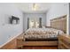 Bright bedroom features wood floors, neutral walls and decorative rug on bed at 3611 19Th N St, St Petersburg, FL 33713