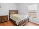 A bedroom features wood flooring and a bed with built in drawers at 3611 19Th N St, St Petersburg, FL 33713