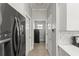 Hallway with refrigerator and wood flooring at 3611 19Th N St, St Petersburg, FL 33713