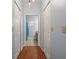 Hallway featuring wood floors, with a view of a well-lit bathroom at 3611 19Th N St, St Petersburg, FL 33713