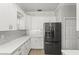 Bright kitchen with white cabinetry, stainless steel appliances, and light countertops at 3611 19Th N St, St Petersburg, FL 33713