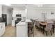 Bright kitchen featuring white cabinets, modern appliances, and a breakfast bar with seating at 3611 19Th N St, St Petersburg, FL 33713