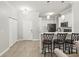 Open-concept kitchen featuring a breakfast bar with seating, stainless steel appliances, and modern lighting at 3611 19Th N St, St Petersburg, FL 33713