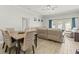 Cozy living room with tile floors, comfortable seating, and sliding glass doors to the patio at 3611 19Th N St, St Petersburg, FL 33713