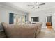 Relaxing living room with tile flooring, leather seating, a ceiling fan, and a view of the backyard at 3611 19Th N St, St Petersburg, FL 33713