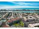 Picturesque aerial view of condo with easy access to waterway, tennis courts, lush landscaping, and ample parking at 8711 Blind Pass Rd # 307A, St Pete Beach, FL 33706