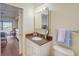 Bathroom with a vanity with cultured marble countertop and lighting at 8711 Blind Pass Rd # 307A, St Pete Beach, FL 33706