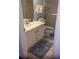 Clean bathroom with a single sink vanity, mirrored cabinet, and a shower with glass door at 20040 Gulf Blvd # 302, Indian Shores, FL 33785