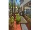 Inviting backyard walkway with lush greenery, mulched landscape, and a peaceful atmosphere at 215 24Th Se Ave, St Petersburg, FL 33705