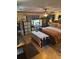 Cozy bedroom featuring a ceiling fan, warm lighting, and wood flooring at 215 24Th Se Ave, St Petersburg, FL 33705