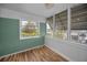 Sunroom featuring hardwood floors, natural light, and nice views at 4140 55Th N St # 1211, Kenneth City, FL 33709
