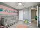 Bedroom with gray walls, pink accents, and light wood-look floors at 451 Hartford Heights St, Spring Hill, FL 34609
