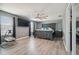 Bedroom with gray walls, ceiling fan, and wood-look floors at 451 Hartford Heights St, Spring Hill, FL 34609