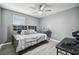 Bedroom with gray walls, ceiling fan, and wood-look floors at 451 Hartford Heights St, Spring Hill, FL 34609