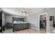 Bedroom with gray walls, ceiling fan, and wood-look floors at 451 Hartford Heights St, Spring Hill, FL 34609