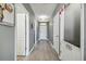 Hallway with gray walls and light wood-look floors at 451 Hartford Heights St, Spring Hill, FL 34609